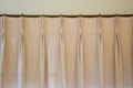 The pink curtains with ring-top rail curtain