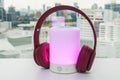 Cute wireless headphone on bluetooth portable speaker with lighting option for music connection Royalty Free Stock Photo