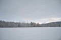 Pink dawn sky over frost ice and snowy winter forest and field Royalty Free Stock Photo