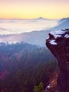 Pink daybreak in hilly landscape. Early winter misty morning in land