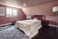 Pink decorated bedroom with sloping ceiling