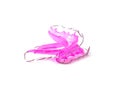 Pink dental retainer orthodontia, isolated on white background Royalty Free Stock Photo