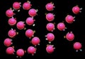 Pink desserts forming 8K on black background, top view Royalty Free Stock Photo