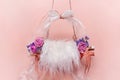 Pink digital background for newborns with a swing and white fur and flowers