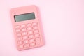 Pink digital calculator on pink background with copy space for your text