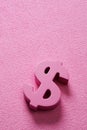 Pink dollar sign on a pink background