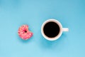 Pink donut with cup of coffee on the blue background. Royalty Free Stock Photo