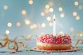 Pink donut and one burning candle against bokeh light background. Happy birthday concept