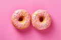 Pink donut pastries with sugar sprinkles Royalty Free Stock Photo