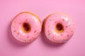 Pink donut pastries with sugar sprinkles Royalty Free Stock Photo