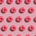 Pink donut with sprinkles seamless pattern, sweet glazed dessert food on pink minimal background Royalty Free Stock Photo