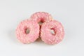 Pink donuts with sprincles on white Royalty Free Stock Photo