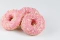 Pink donuts with sprincles on white Royalty Free Stock Photo