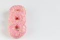 Pink donuts with sprincles on white Royalty Free Stock Photo