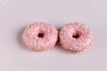 Pink donuts with sprincles on white Royalty Free Stock Photo