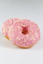 Pink donuts with sprincles on white Royalty Free Stock Photo