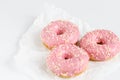 Pink donuts with sprincles on white Royalty Free Stock Photo