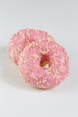 Pink donuts with sprincles on white Royalty Free Stock Photo