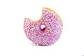 Pink doughnut with a bite taken out isolated on wh