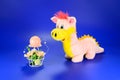 Pink dragon toy with decorative candle with flowers