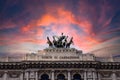 Pink dramatic skies during sunset over the bronze horses at corte di cassazione supreme court in Rome