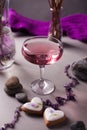 Pink drink in a glass in a romantic elegant setting - a women`s party or a romantic date.