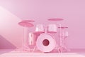 Pink drum kit on concrete wall background