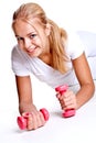 Pink dumbbells in the hands of women