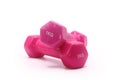 Pink dumbbells with one kilogram weight on white