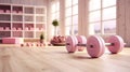 pink dumbbells on wooden floor