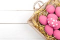 Pink Easter eggs on wodden background. Still life photo of lots of pink easter eggs. Copyspace.