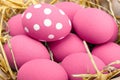 Pink Easter eggs on wodden background. Still life photo of lots of pink easter eggs. Copyspace.