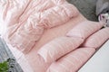 Pink ecologycal linen on bed in modern home interior. Daylight Royalty Free Stock Photo