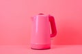 A pink electric kettle on a pink background. AI generative image . A lot of copy space.