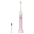 Pink electronic ultrasonic toothbrush on a charge stand with a changeable tip Royalty Free Stock Photo