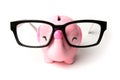Pink elephant piggy bank with glasses isolated on a white background Royalty Free Stock Photo