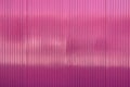Pink embossed metal surface close up background