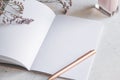 Pink empty paper notebook with golden pen