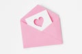 Pink envelope with heart icon on white background - Love concept