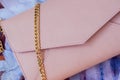 Pink envelope purse with gold chain close-up Royalty Free Stock Photo