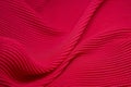 Pink fabric background. Pink cloth waves background texture.