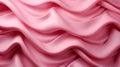 A pink fabric with wavy folds