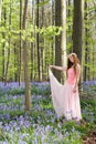 Pink fairy in bluebells forest Royalty Free Stock Photo