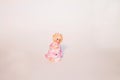 Pink fairy figurine on a white background