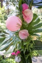 Pink fake flamingo wedding decoration with anthurium flowers and