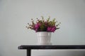 Pink fake flowers on table