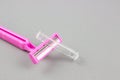 Pink female razor on grey background. Removal of unwanted hair. Close up. Female body care concept Royalty Free Stock Photo