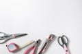 Pink feminine handy tools on a white background. Copy space Royalty Free Stock Photo