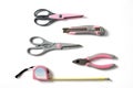 Pink feminine handy tools on a white background Royalty Free Stock Photo