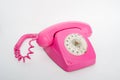 Pink telephone on a white background Royalty Free Stock Photo